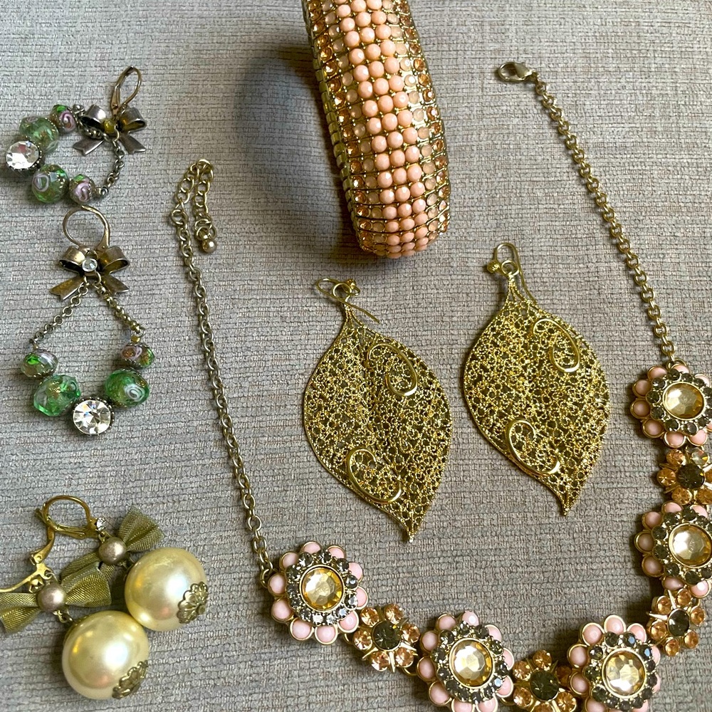 3 earrings, one necklace and one bracelet bangle